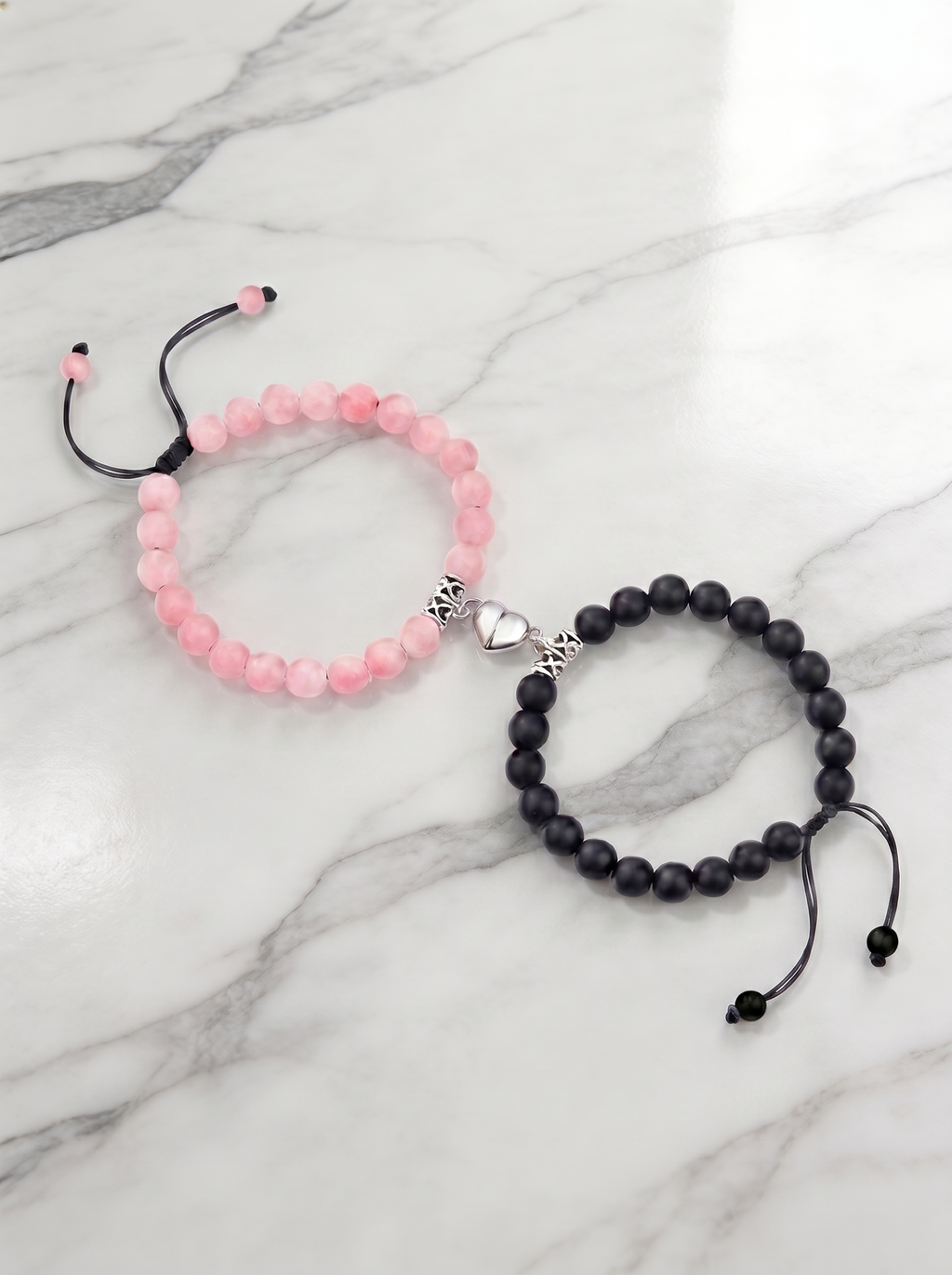 Detalle dije corazón magnético pulseras pareja New Concept Fusión Hearts